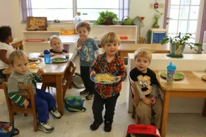 A child working with Montessori language cards to build vocabulary and word recognition.